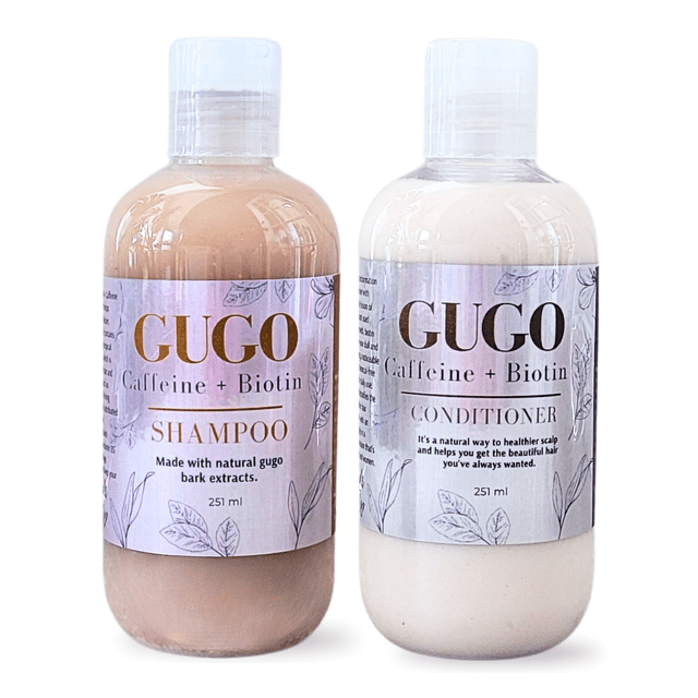 Gugo with Biotin + Caffeine Shampoo & Conditioner set by Nature Skin Shop, featuring two 251 ml bottles. The shampoo, in a light brown hue, and the conditioner, in an off-white shade, are enriched with natural gugo bark extracts, biotin, caffeine, and pro-vitamin B5. Designed to promote hair growth, reduce breakage, and maintain a healthy scalp, this sulfate-free and silicone-free set is suitable for all hair types.