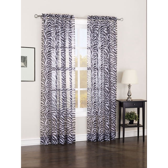 No. 918 Bangali Voile Print Rod Pocket Curtains in sheer voile fabric with black and white zebra print, 40 by 84 inches, hanging on a silver rod in a room with white walls, dark wood floor, and a black side table with lamp and plant, ideal for light filtering and decorative window coverings.