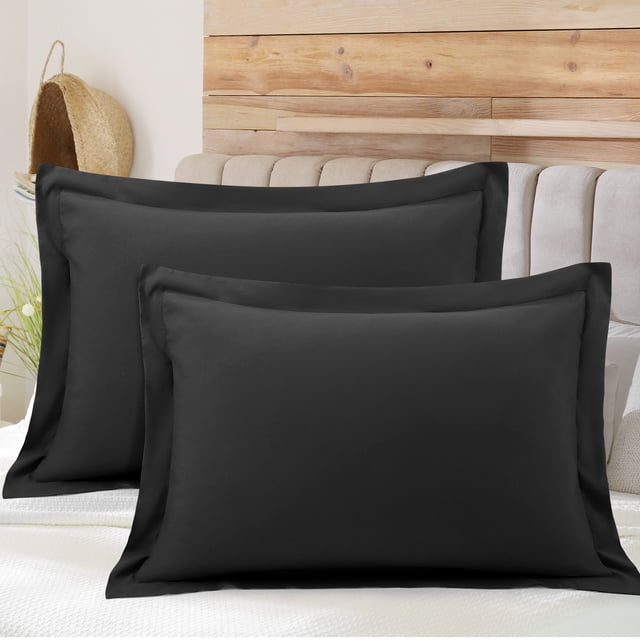 PiccoCasa Soft 1800 Microfiber Oxford Pillowcases 2Pcs, Queen Black. The set includes two black pillow shams made of 1800 series brushed microfiber, offering a soft and lightweight texture with a durable structure. Each pillowcase features a 2-inch flange and an envelope closure design to keep pillows secure. Sized at 20 x 30 inches, these breathable and machine-washable pillowcases are ideal for enhancing bedding aesthetics.