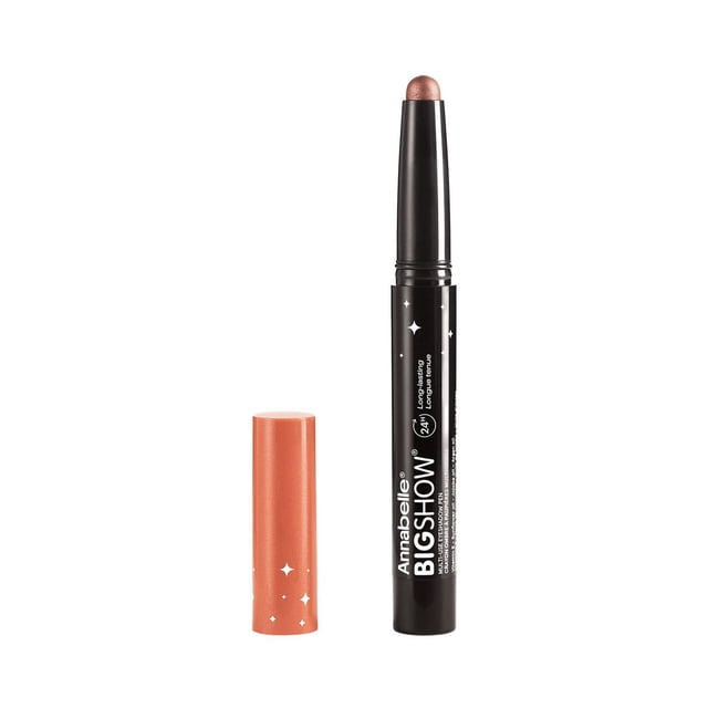 Bigshow Multi-Use Eyeshadow Pen by Annabelle featuring a twist-up cream eyeshadow and liner stick in a shimmery bronze shade with a black barrel and matching copper cap beside it, designed for easy application and long-lasting wear.