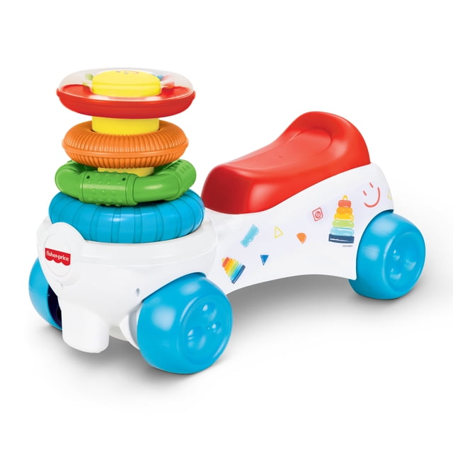 Fisher Price Rock A Stack Ride On avec une Carrosserie en Plastique Blanche, un Siège Rouge et Quatre Larges Roues Bleues pour la Stabilité. Il Présente une Pile d'Anneaux Vifs et Texturés en Rouge, orange, Vert et Bleu Qui Stimulent l'Expérience Sensorielle et les Habiletés Motrices, plus des Guidons à Prise Facile et des Décalcomanies Colorées.