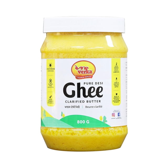 Verka Ghee Desi Pur, 800 g, dans un Pot Transparent avec Couvercle Blanc, Montrant du Beurre Clarifié Jaune Doré. l'Étiquette Note Qu'il Est Végétarien, Sans Gluten, Compatible Céto, avec un point de Fumée Élevé et un Riche Arôme de Noisette, Idéal pour la Friture et le Sauté dans la cuisine Indienne.