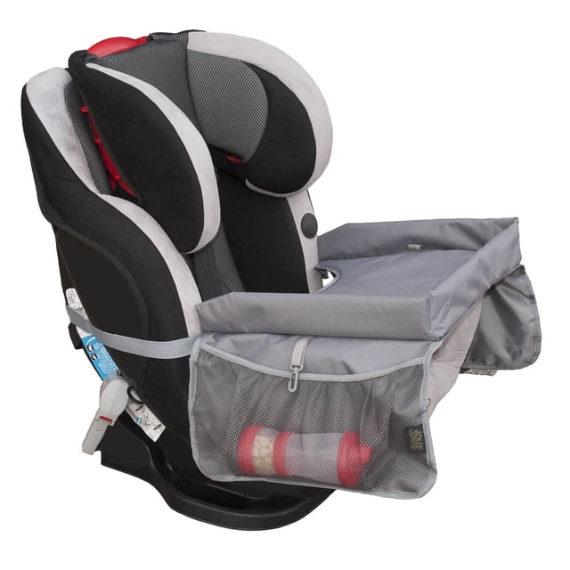 Jolly Jumper Travel Tray in grey fabric with rolled rim and mesh side pockets, securely buckled to a black and grey padded child car seat, providing a stable surface for snacks, drawing, and travel activities in cars, strollers, and airplanes.