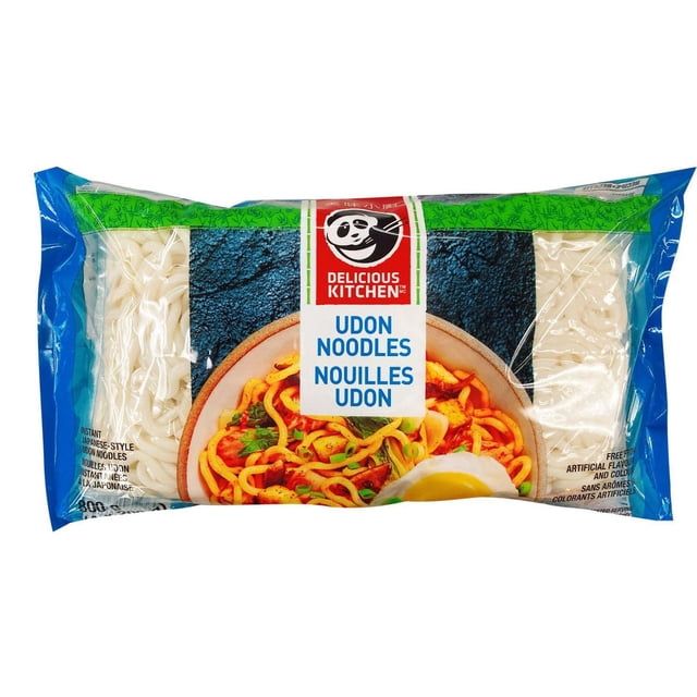 Udon noodles by Delicious Kitchen in clear packaging showing thick, round white noodles with a label featuring a bowl of stir-fried udon with vegetables and egg, made with fresh-keeping technology for chewy texture, suitable for soup, cold dishes, stir-fry, and hot pot.