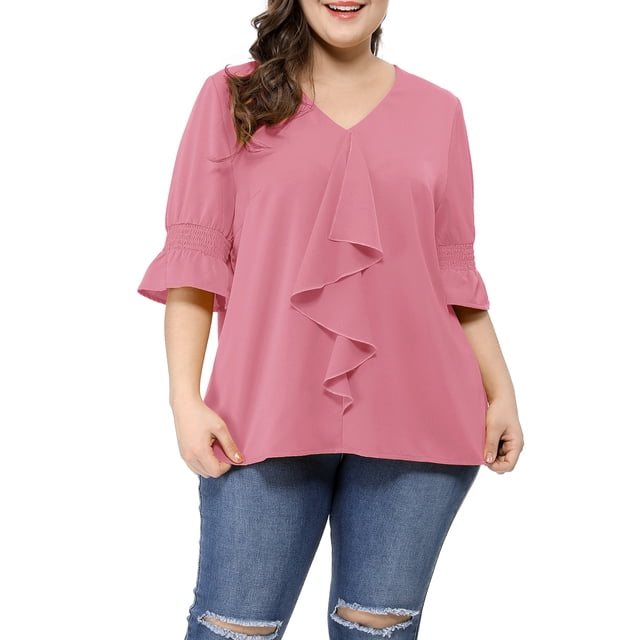 GRACE & GRANDEUR Women's Plus Size Blouse in pink, featuring a V-neck design, ruffle front, and smocked short sleeves with bell cuffs. Made from 100% polyester, this solid casual top offers a comfortable drape and a flattering fit. Ideal for pairing with jeans for a casual look or a pencil skirt for a professional setting.