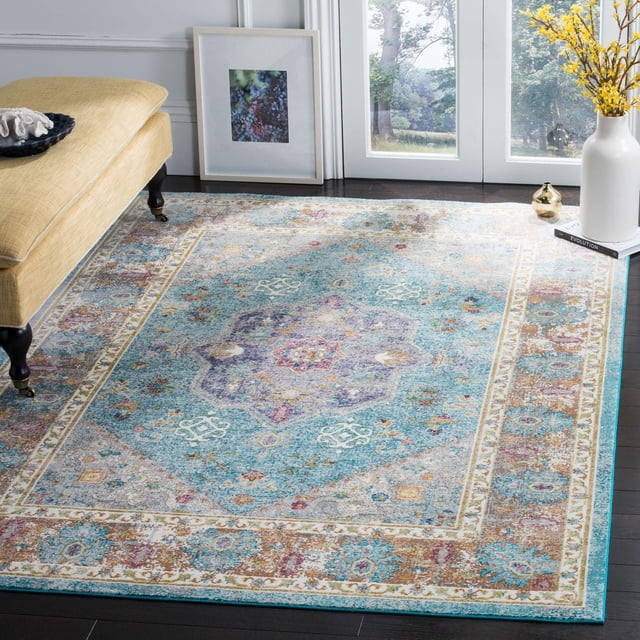 SAFAVIEH Aria Rosalin Traditional Area Rug featuring a distressed Persian-style medallion and floral motifs in blue, purple, and beige tones, power loomed from synthetic yarns for durability, displayed on dark hardwood floors near a yellow upholstered bench and a white vase with yellow flowers, ideal for high-traffic areas.