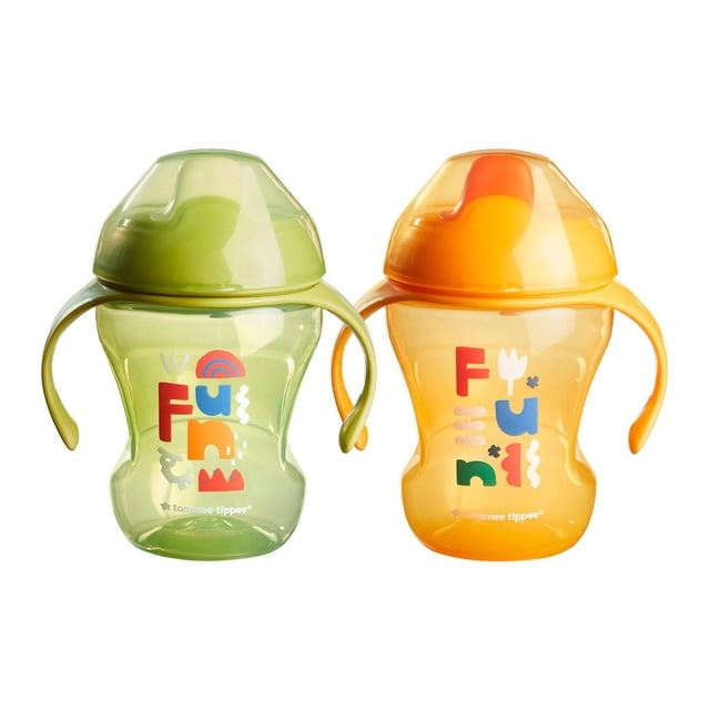 Tommee Tippee Sippee Trainer Cup with Handles, Spill-Proof, 8oz, 7m+, Pack of 2 with two toddler sippy cups in green and orange featuring ergonomic easy-grip handles, spill-proof lids, durable bite-resistant spouts, and colorful 'Fun' designs, suitable for toddlers learning to drink independently.
