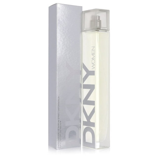 Dkny by Donna Karan Energizing Eau De Parfum Spray 3.4 oz, featuring a sleek, transparent bottle with a minimalist design and bold DKNY branding. The perfume is displayed alongside its silver-toned packaging, emphasizing its modern and elegant aesthetic.