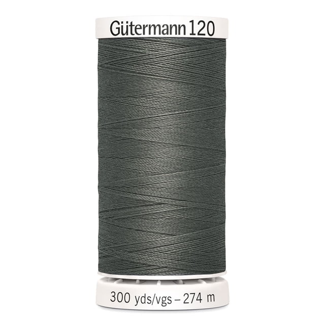 Gutermann 120 100% polyester all purpose thread spool in grey, tightly wound on a white plastic spool labeled with brand and length 300 yards (274 meters), suitable for machine and hand sewing woven, knit, and synthetic fabrics, also ideal for craft and mending projects.