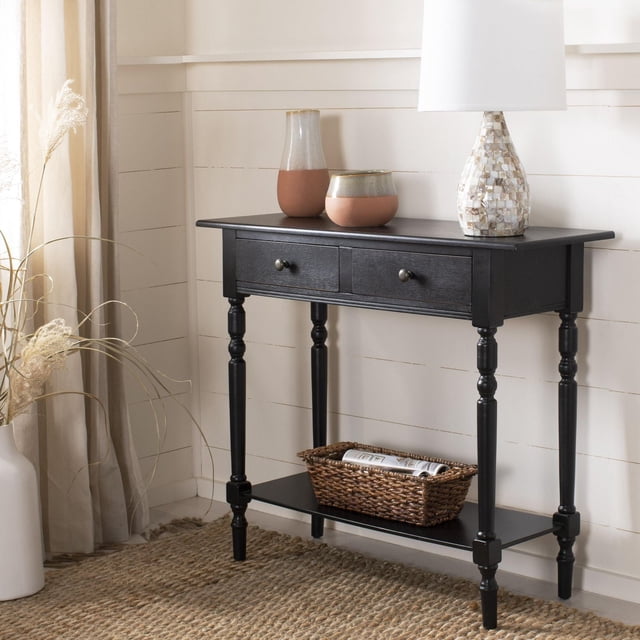 SAFAVIEH Rosemary Solid Contemporary 2 Drawer Console with Shelf distressed black pine console, front-facing craftsman-style silhouette with two drawers with metal pulls, open bottom shelf and visible wood grain; shown in a neutral entryway; minor assembly required. Often used as hallway storage or compact media stand.