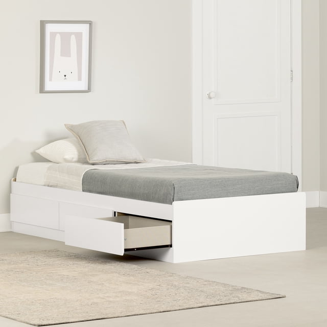 South Shore Fusion Twin Mates Bed with 3 Drawers in pure white, a minimalist platform bed with rounded corners and handleless drawers, one drawer open showing storage space, dressed with grey and beige bedding in a neutral kid’s room with a framed bunny print, suitable for organizing clothes and toys with smooth metal slide drawers.