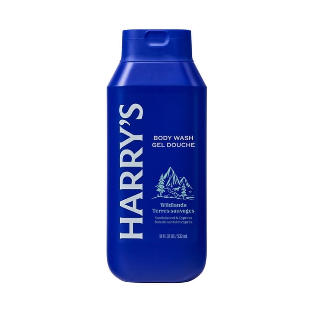 Harry's Cleansing Wildlands Body Wash in a blue plastic bottle with flip-top cap, featuring white text and mountain graphic, containing 18 fl oz (532 ml) of men's bath and shower gel with sandalwood and cypress scent, formulated for deep cleansing and smooth skin.