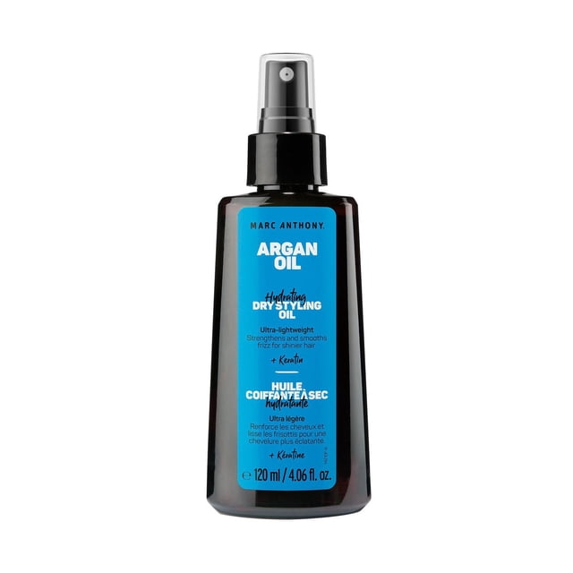 Marc Anthony Huile d'Argan du Maroc Huile de Coiffage Sèche en Bouteille Vaporisateur de 120 ml Ambre Foncé avec Pompe Noire et Étiquette Bleue, Infusée de Kératine et d'Huile d'Argan pour Hydrater, Nourrir et Lisser les Frisottis pour des Cheveux Brillants et Revitalisés, Convient comme Sérum Capillaire Léger et Sans sulfates Ni Parabènes.
