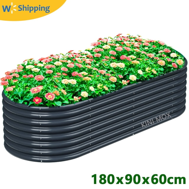 6x3x2FT gray raised garden bed made of corrugated galvanized steel with eco-friendly powder coatings, shown filled with colorful flowers. The oval-shaped, heavy-duty planter box is designed for planting vegetables, flowers, and herbs. It features a bottomless design for unrestricted root growth and is resistant to rust and corrosion, suitable for outdoor use in various weather conditions.