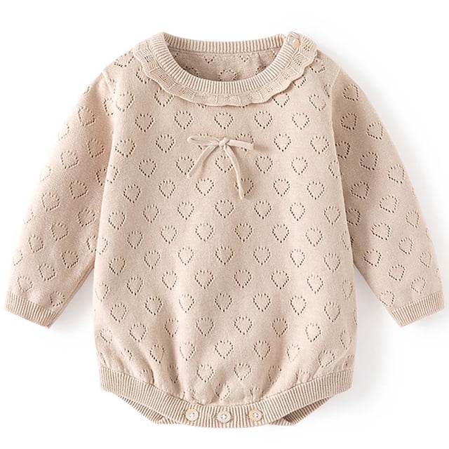 Amzcrzy Cotton Romper Hollow Thin Lace Collar Baby Bodysuit in beige with a heart-shaped cutout pattern, lace-trimmed collar, and bow detail on the chest. This long-sleeve baby girl onesie features snap closures for convenience and is crafted from soft, breathable fabric. Perfect for casual outings, family gatherings, or photoshoots.