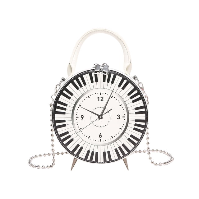 FOCUSNORM Women Fashion Crossbody Purses Clock Shaped Shoulder Bags Leather Handbag Clutch Purses. This chic bag features a clock-shaped design with a piano key pattern, made from durable PU leather. It includes a top handle and a detachable chain strap for versatile use as a crossbody, shoulder bag, or handbag. The zip closure ensures secure storage of essentials like credit cards, keys, and cosmetics. Measuring 16.5cm x 7cm x 16.5cm (6.5 x 2.76 x 6.5 inches), it is ideal for parties, travel, or everyday use.