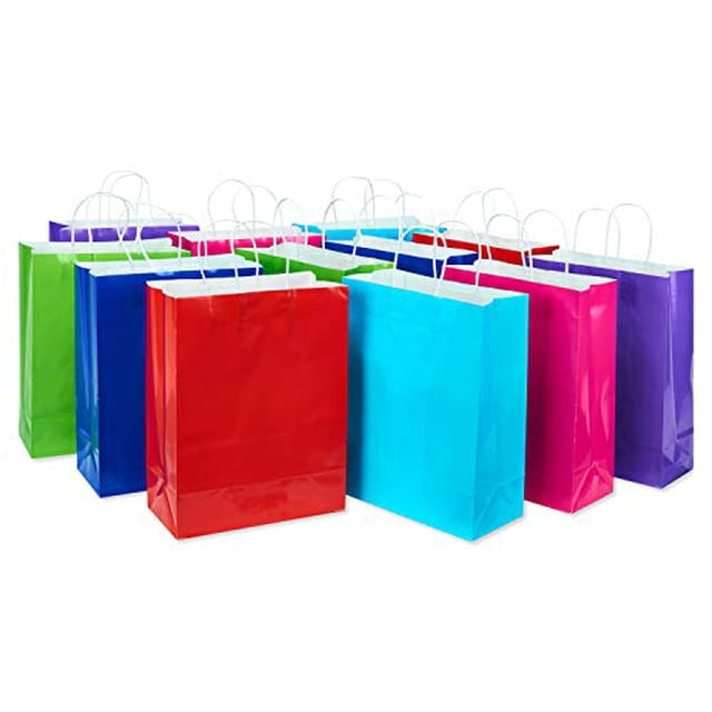 American Greetings 10" Medium Gift Bags, Rainbow Solids (12-Count) showing twelve medium paper gift bags in a multicolored assortment of red, pink, green, blue, navy, and purple with white twisted handles, suitable for party supplies, wrapping accessories, and ideal for treats, favors, and celebrations.