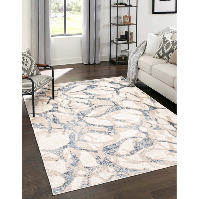 ECARPET Azalea Contemporary/Modern Area Rug with beige and blue abstract floral and botanical patterns on dark hardwood floor in a bright living room with a beige sofa, patterned pillows, a black metal chair, and a shelving unit near a window with grey curtains. Ideal for living rooms, bedrooms, or hallways.