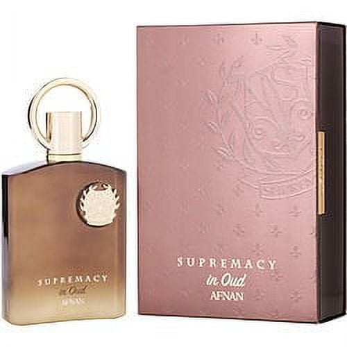AFNAN SUPREMACY IN OUD by Afnan Perfumes, an Eau de Parfum spray in a 3.4 oz bottle. The fragrance features a refreshing, oriental, and woody scent, ideal for various occasions. The image shows the perfume bottle with a gold-toned finish and a circular cap, alongside its elegant pink packaging embossed with subtle patterns.