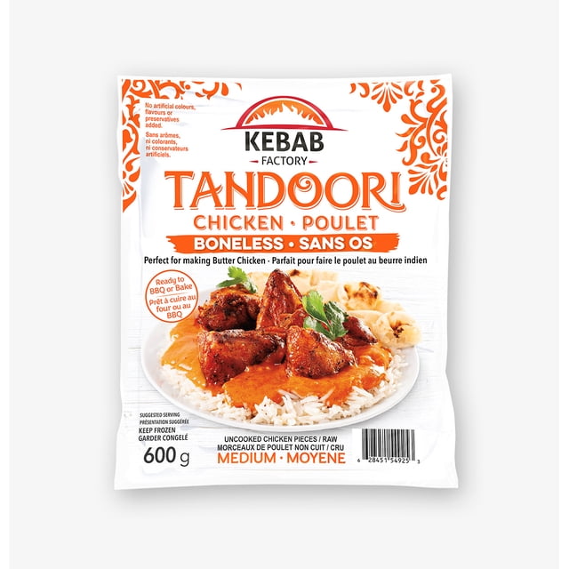 Boneless Tandoori Chicken by Kebab Factory, 600g frozen raw halal chicken pieces with medium spice level. The white package features orange ethnic patterns and a serving suggestion of tandoori chicken on rice with naan, ideal for oven baking or BBQ grilling.