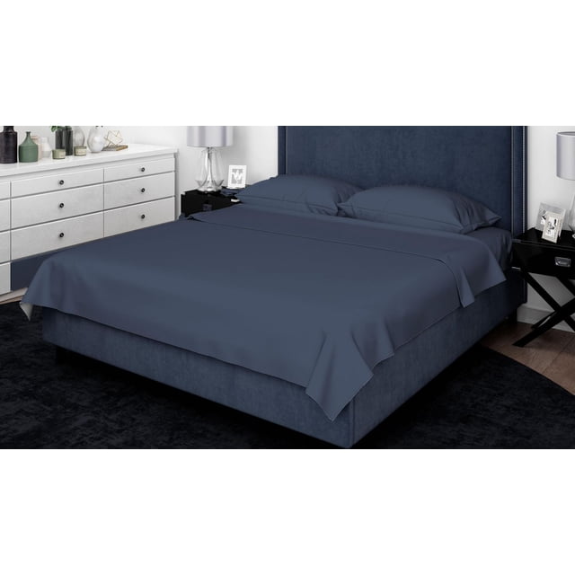 Johnson Home 500 Thread Count Liquid Cotton Sheet Sets in dark blue on a king-size bed with matching upholstered headboard, featuring smooth, wrinkle-resistant sateen fabric and deep 15-inch fitted sheet pockets, in a modern bedroom with black nightstands and white dresser.