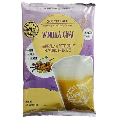 Big Train 3.5 lb. Vanilla Chai Tea Latte Mix in a purple and yellow bag featuring the Big Train logo. The packaging highlights its spiced vanilla chai flavor, suitable for hot, iced, or blended drinks. Includes 46 servings per bag, ideal for coffee shops, restaurants, and cafes.