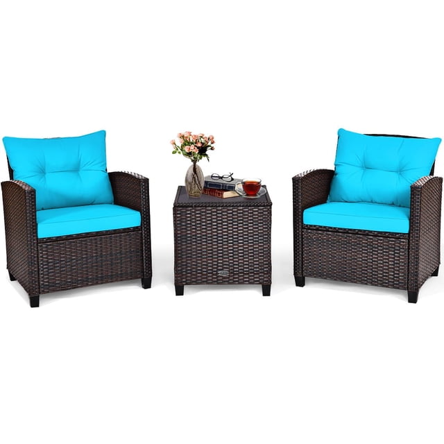 Giantex 3 Pieces Patio Furniture Set featuring two PE rattan wicker chairs with turquoise cushions and a matching coffee table with a tempered glass tabletop. The set is designed for outdoor use in gardens, patios, or poolside areas. The chairs have wide armrests and thick cushions with removable, washable covers for added comfort. The coffee table provides a sturdy surface for drinks or decor, with a glass top secured by four suckers. The rattan material is weather-resistant, and the steel frame ensures durability.