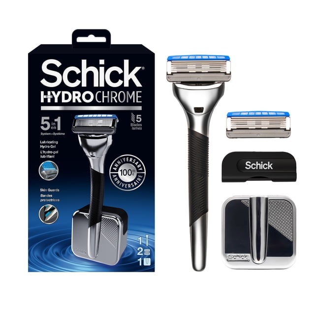 Schick Hydro Chrome men’s razor with a heavyweight metal handle and 5 blades in a 5-in-1 close shave system, shown with a magnetic docking station, extra blade cartridge, and black travel cap, alongside the product packaging highlighting lubricating hydro gel and skin guards.