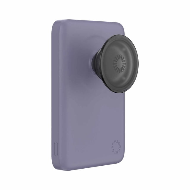 PopSockets MagSafe Power Pack Charger 5000 mAh Dusk shown in a 3/4 profile with a matte dusk purple rectangular body and an attached black PopSockets grip and stand, magnetically snapping to MagSafe-compatible phones for wireless charging.