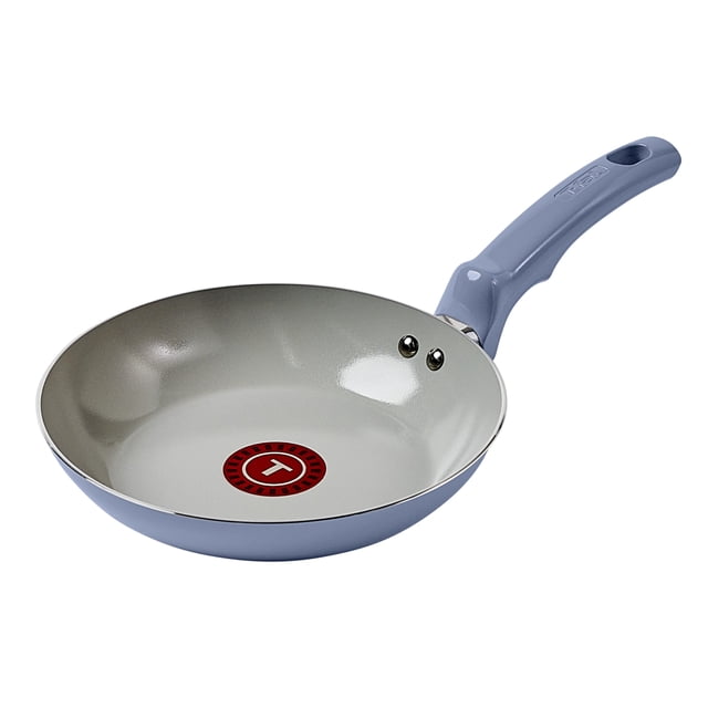 T-fal Ceramic Essential 20 cm / 7.9" frypan with light blue recycled aluminum body and ceramic nonstick interior featuring a red Thermo-Spot heat indicator, ergonomic stay-cool handle, and even heat base, compatible with all cooktops except induction and oven safe up to 350°F, suitable for healthy cooking with little oil.