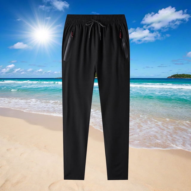 Deals of The Day Clearance! Men's large size solid color casual fashion loose ice silk sweatpants with drawstring and zipper pockets, ideal for exercise and sports. The black sweatpants are displayed against a sunny beach background, featuring an elastic waistband and breathable polyester material for plus-size men.