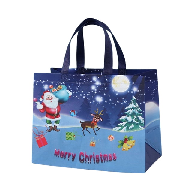 Christmas Tote Bags With Handles, featuring a festive design with Santa Claus, a reindeer, and gift boxes on a snowy background under a starry night sky. Made of durable non-woven fabric, this reusable grocery bag measures 12.8 x 9.8 x 6.7 inches (32 x 25 x 17 cm) and includes sturdy handles for easy carrying. Ideal for holiday parties, gift wrapping, or grocery shopping.