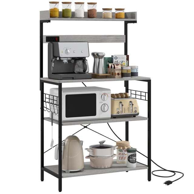HOMCOM Kitchen Bakers Rack with Power Outlet, Adjustable Shelves and Hooks. A stylish and functional kitchen storage rack with distressed grey particle board and black steel frame. Features multiple shelves, including one adjustable, for organizing kitchen essentials, and five S-shaped hooks for hanging utensils. Built-in power outlets support appliances like coffee makers and microwaves, ideal for a coffee bar setup or industrial microwave stand. Adjustable feet and anti-tipping hardware ensure stability. Shown holding a coffee maker, microwave, toaster, and various kitchen items.