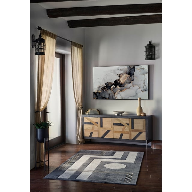 ECARPET Erisa Contemporary Area Rug for Living Room, Bedroom, Dining Room, Entrance, Hallway and More with a geometric charcoal, cream, and gold pattern on a hardwood floor in a room with beige curtains, a wooden sideboard featuring mixed wood panels, and abstract marble-inspired wall art, ideal for enhancing family home interiors.