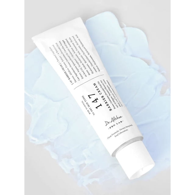 Dr. Althea 147 Barrier Cream 50ml tube displayed against a textured light blue background, featuring its sleek white packaging with black text. This face moisturizer is designed to hydrate and support sensitive or dry skin.