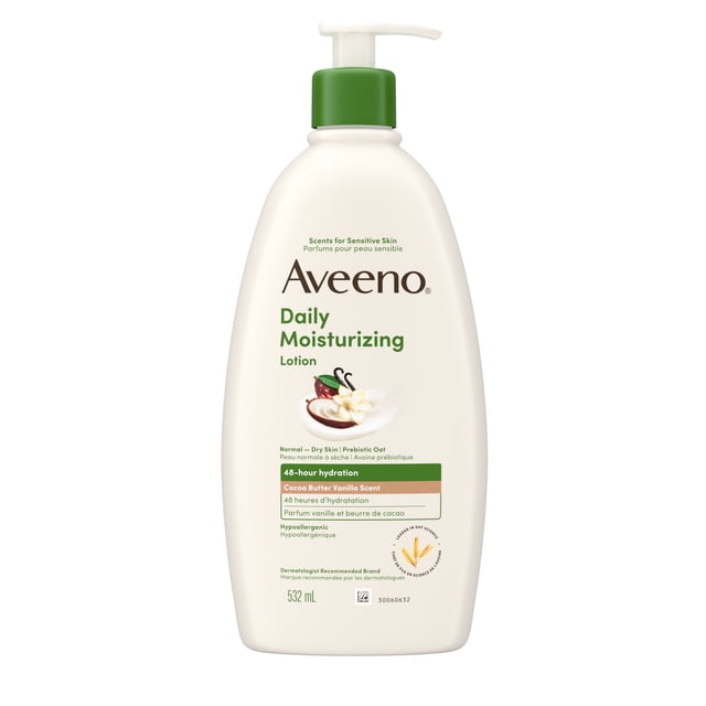Aveeno Daily Moisturizing Lotion Cocoa Butter Vanilla Scent 532 ml bottle with white pump and green collar, lightweight lotion for normal to dry sensitive skin, enriched with prebiotic oat for 48-hour hydration, hypoallergenic and non-comedogenic, suitable for daily body care.
