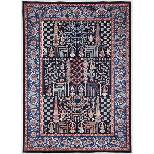 Emerald Duluth Grey & Blue 5' x 7' area rug with low pile and detailed traditional floral and geometric patterns in grey, blue, red, and beige. It features a blue floral border and intricate central motifs on a dark background, made from easy-care polyester with felt backing and rubber grips, suitable as a kitchen mat or for high traffic areas.
