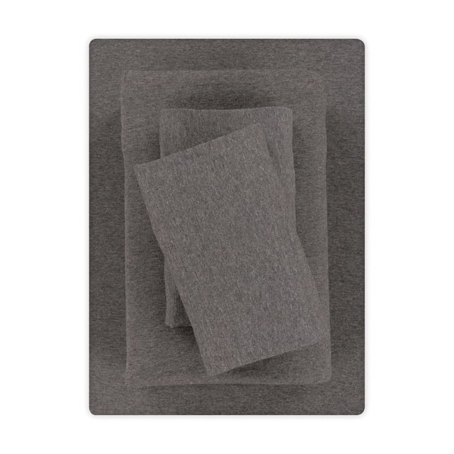 Mainstays Cotton Rich Extra Soft Jersey Bed Sheet Set, Double, Charcoal, 4 Pieces Centered folded view of a charcoal jersey-knit sheet set showing a flat sheet, extra-deep fitted sheet with elasticized edges that fit mattresses up to 15-inch deep, and two standard/queen pillowcases; 60% cotton/40% polyester blend with visible soft stretch texture, machine washable, often used for guest rooms or staging spare bedrooms.