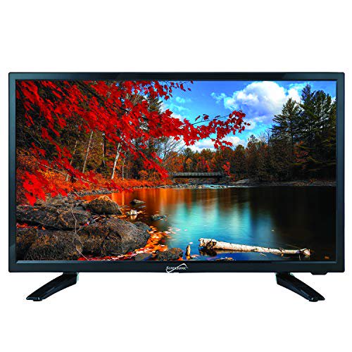 SuperSonic SC-2411 LED Widescreen HDTV & Monitor, 24-inch flat screen with USB compatibility, SD card reader, HDMI, and AC/DC input. This LED monitor features built-in digital noise reduction and is suitable for use as a computer monitor or TV. The screen displays a vivid image of a serene lake surrounded by autumn trees. DC cable not included.