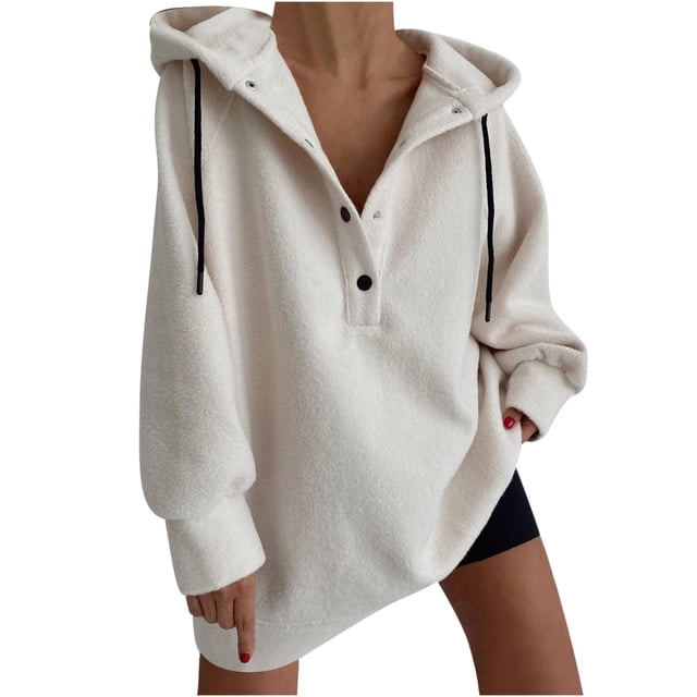Timegard Women's Sweatshirts Button Long Sleeve Solid Color Oversized Hoodies Winter Fleece Warm Pullover. A front-facing view of a loose-fitting, solid white hoodie with a buttoned neckline, black drawstrings, and long sleeves. Made of polyester and cotton, it features a soft fleece interior for warmth, ideal for fall and winter. Styled casually, it pairs well with jeans, joggers, or layered tops.