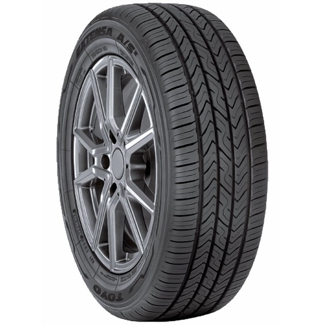 Toyo Extensa AS II Pneu 215/65R17 99H pour Voiture de Tourisme Toutes Saisons Monté sur une Roue en Alliage Argent à Rayons Multiples, Doté d'Une Bande de Roulement Noire avec Quatre Rainures Circonférentielles et un Mélange à Base de Silice pour une Adhérence sur Sol Mouillé Améliorée, une Durabilité Améliorée et une Efficacité Carburant Améliorée, Idéal pour VUS et Véhicules Croisés.
