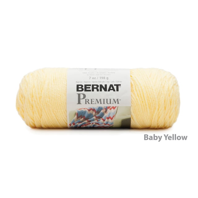 Bernat® Premium™ Yarn in baby yellow, 7 oz (198 g) acrylic worsted weight yarn with 360 yards (329 m), shown front-facing with a white label displaying the brand and a knitted blanket image, ideal for knitting and crochet projects including garments and afghans.