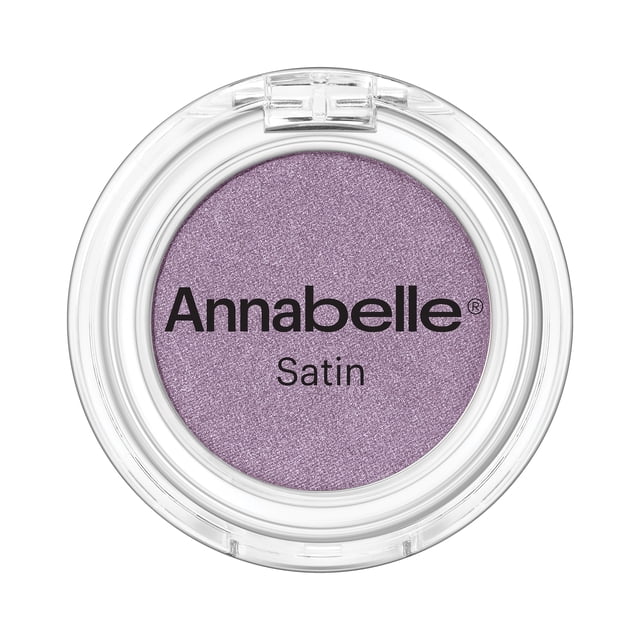 Annabelle Satin Single Eyeshadow, Aura, in a clear round compact with a soft purple satin finish. This highly pigmented, blendable powder eyeshadow features a velvety texture and long-lasting formula ideal for shading and adding depth to eyelids.