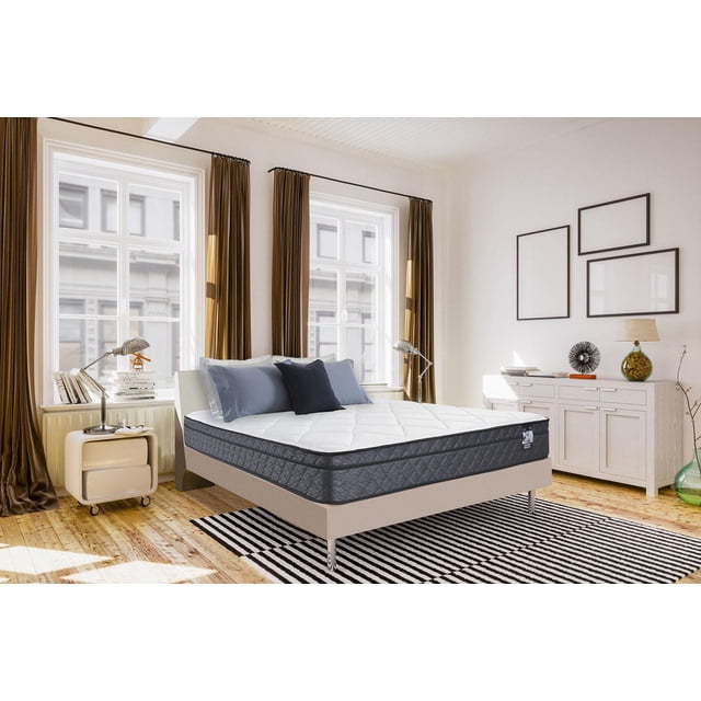 Springwall BELINDA 8.5" Medium Firm Euro Top Pocket Coil Mattress in a box in a bright bedroom with wooden floors, featuring a white quilted gel foam top and dark grey quilted sides, on a beige platform bed with chrome legs, accented by blue pillows, placed on a black and white striped rug near large windows with brown curtains and a white sideboard with framed art and decor, showcasing its zoned innerspring pocket coil support and temperature-regulating gel foam.
