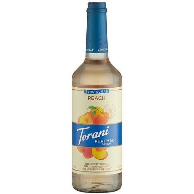 Torani Puremade Zero Sugar Peach Flavoring Syrup in a 750 mL (25.36 oz) glass bottle. The bottle features a blue cap and label with peach illustrations, highlighting its zero sugar and natural peach flavor. Ideal for flavoring beverages, desserts, and culinary recipes.