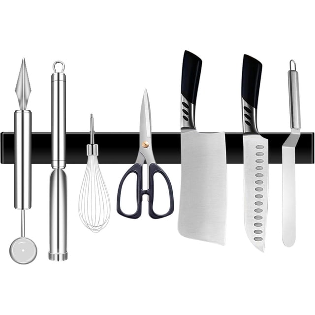 Matte Black Magnetic Knife Strip made of high-quality stainless steel, measuring 30x1.5x4 cm, shown mounted on a wall holding various kitchen tools including knives, scissors, and utensils. The strong magnet securely holds items in place, showcasing its space-saving and no-drilling installation design.