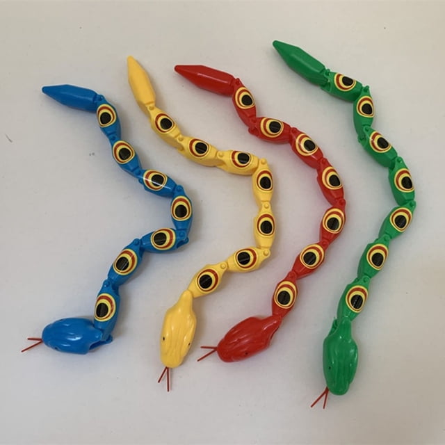 Lubelski Twisted Jointed Snake Nostalgic Lightweight Plastic Funny Joint Snake Prank Toy for Fun. Four colorful plastic snakes in blue, yellow, red, and green are displayed on a white surface. Each snake features jointed segments, black circular patterns resembling eyes, and flexible designs. Ideal for parties, gag gifts, and prank toy enthusiasts.