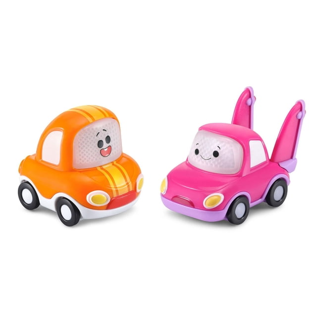 VTech Go! Go! Cory Carson PlayZone™ Cory & Frannie Mini - English Version with two colourful plastic mini cars featuring smiling faces, one orange with yellow stripes and one pink with purple wings, designed for interactive educational electronics playsets for kids.