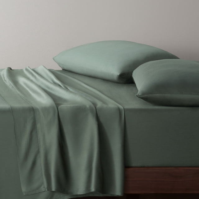 Allswell 300 Thread Count Soft & Silky 4-Piece Viscose from Bamboo Sateen Sheet Set in moss-green, including a fitted sheet, flat sheet draped over the side, and two pillowcases on a wooden bed frame, crafted with breathable, moisture-wicking bamboo fabric suitable for all seasons and everyday use.