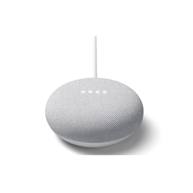 Google Nest Mini (2nd Generation) smart home assistant in chalk grey with a rounded fabric mesh top and four white LED indicator lights, shown from a front 3/4 angle with a white power cable extending from the back, suitable for voice control and managing compatible smart devices.